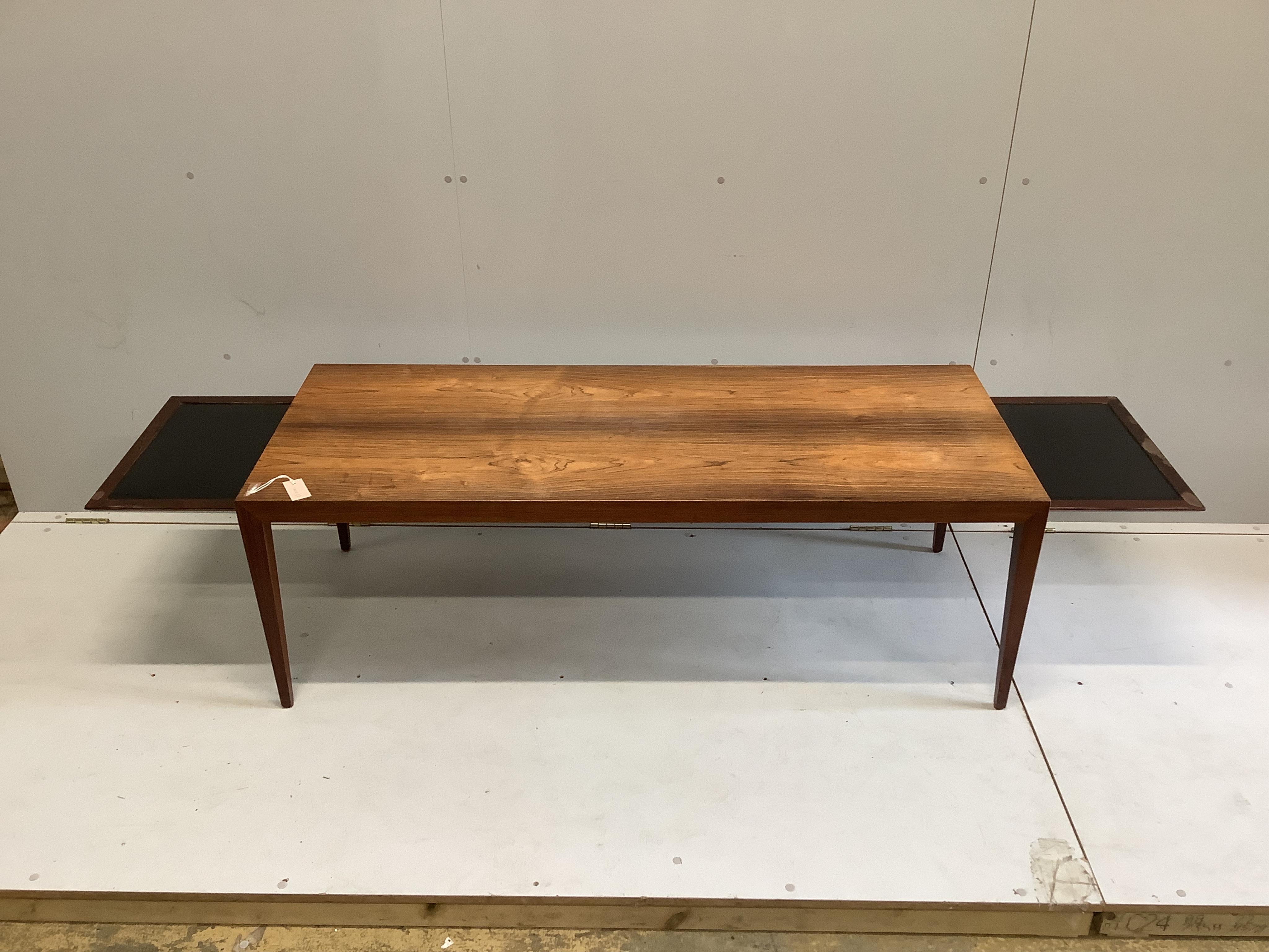 In the manner of Johannes Anderson, a mid century rectangular Indian rosewood coffee table, width 150cm, depth 60cm, height 50cm